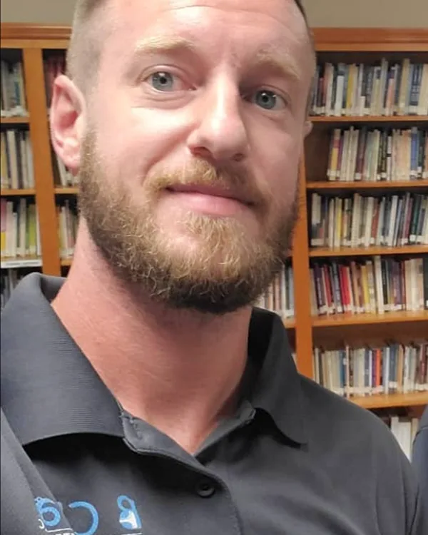 Bryan Wilson, owner of B Clean Carpet & Upholstery, in his company polo