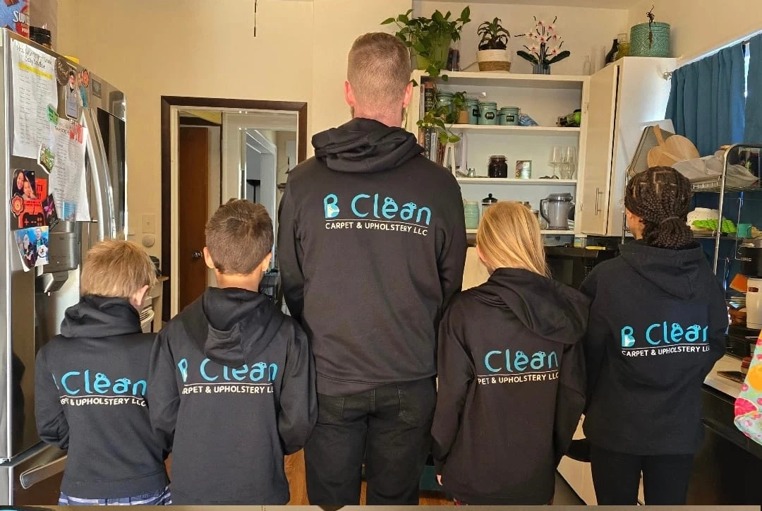 Bryan and his family in B Clean hoodies